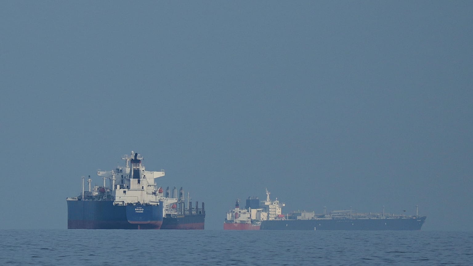 Oil tankers and cargo ships line up in the Strait of Hormuz as seen from Khor Fakkan, United Arab Emirates, Wednesday, March 11, 2026. 