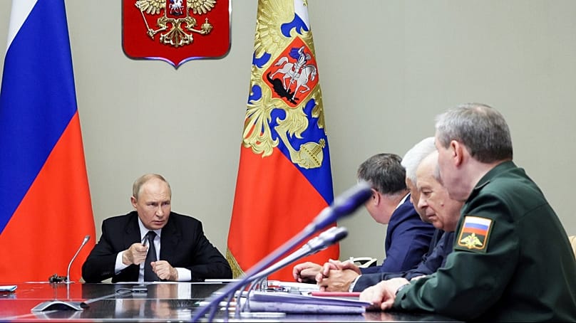 Russian President Vladimir Putin, left, leads a meeting with top security and defense officials (Gavriil Grigorov, Sputnik, Kremlin Pool Photo via AP, File)