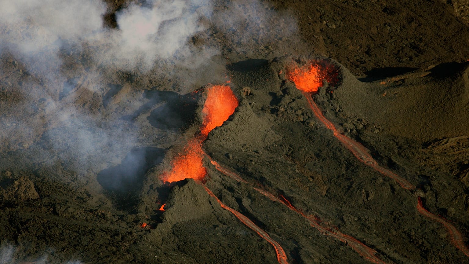 FILE: Aerial view of the Piton de la Fournaise volcano as it erupts on La Reunion Island in the Indian Ocean