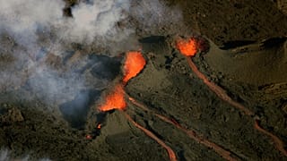FILE: Aerial view of the Piton de la Fournaise volcano as it erupts on La Reunion Island in the Indian Ocean
