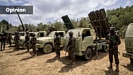 FILE: Fighters from the Lebanese militant group Hezbollah carry out a training exercise as they stand in front of launcher rockets trucks, southern Lebanon, May 21, 2023