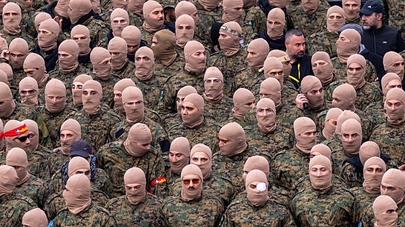 FILE: Hezbollah fighters during a funeral procession at the Sports City Stadium in Beirut, Lebanon, Sunday, Feb. 23, 2025
