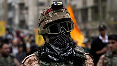FILE: A member of the Iranian Basij paramilitary force attends the annual anti-Israeli Quds Day, or Jerusalem Day rally in support of Palestinians, in Tehran, 28 March 2025.