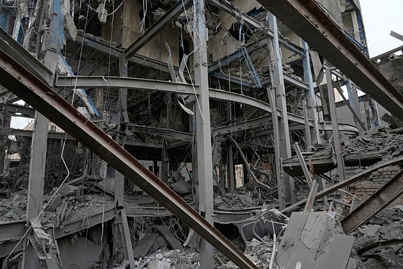 The shattered structure of a police station is seen after it was hit in Tehran, 15 March, 2026