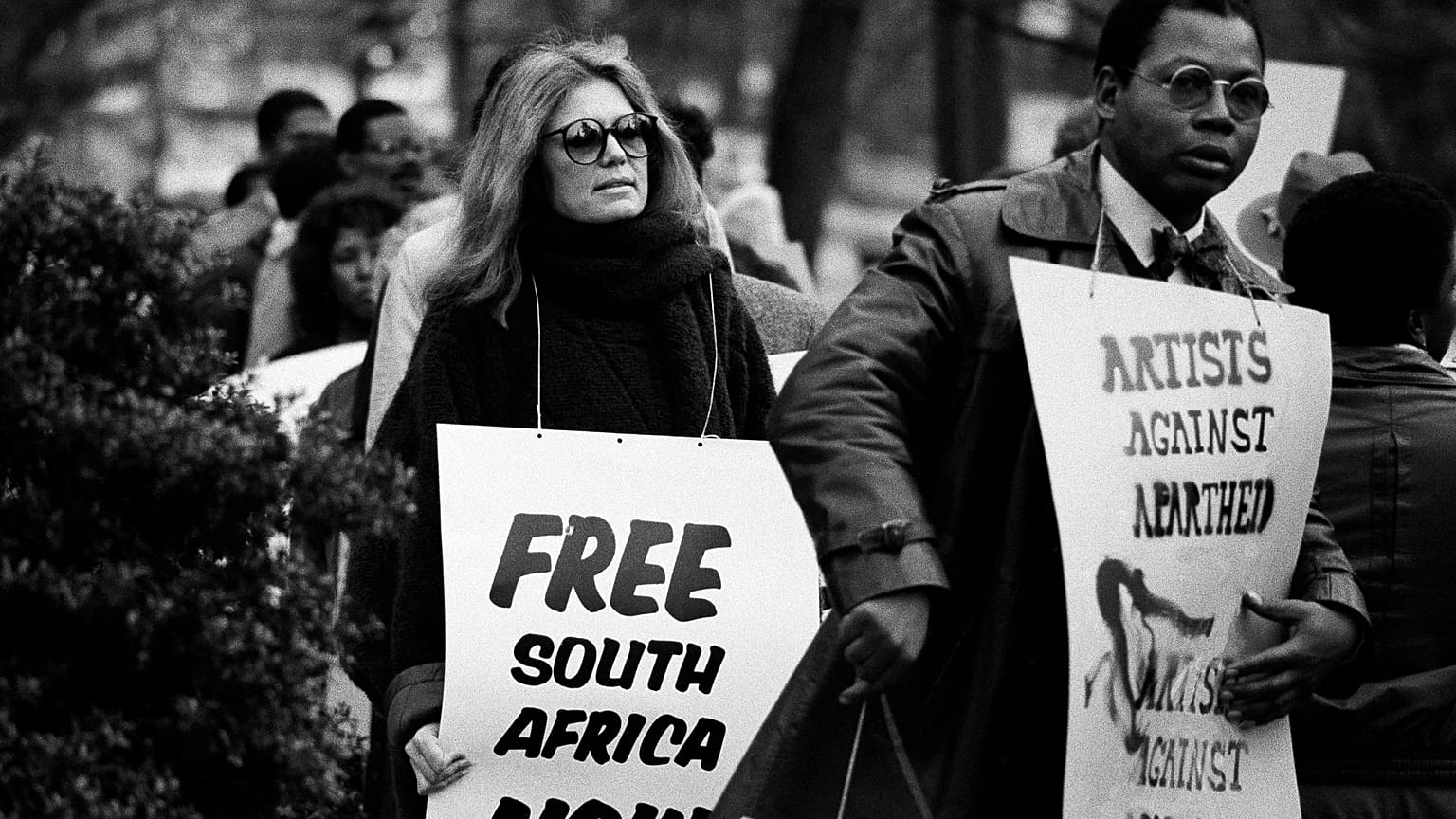 Feminist Gloria Steinem walks a picket line outside the South African Embassy in Washington, December 20, 1984. Steinem joined protests agaisnt the South African racial polici