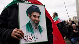 FILE - A demonstrator holds a portrait of the Ayatollah Mojtaba Khamenei during the Al Quds day in London, England, Sunday, March 15, 2026. (AP Photo/Alberto Pezzali)