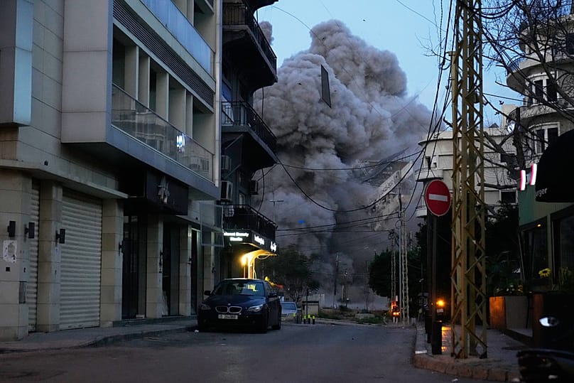 Smoke rises from a building following an Israeli strike in central Beirut, Lebanon, Wednesday, March 18, 2026