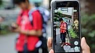  Students play Pokemon Go in the street as its released in Tokyo (AP Phot/Koji Sasahara)