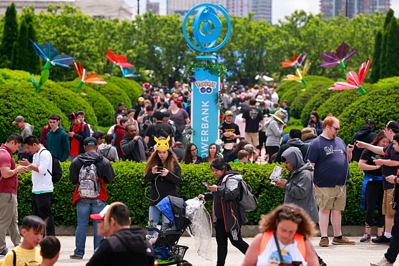 Participants at Pokemon GO Fest 2019 while searching for characters as they play Pokemon GO (AP Photo/Amr Alfiky)