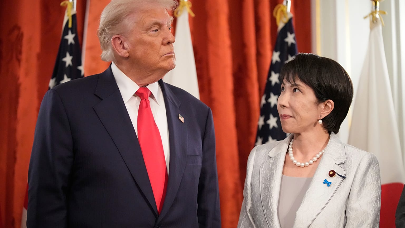 Japan's Prime Minister Sanae Takaichi looks to President Donald Trump as they meet at Akasaka Palace in Tokyo, Oct. 28, 2025.(AP Photo/Mark Schiefelbein)