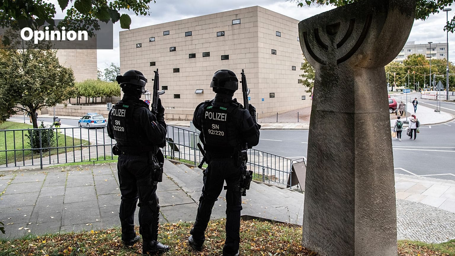 Police officers secure a synagogue in Dresden, Germany, Wednesday, Oct. 9, 2019