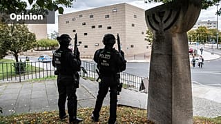 Police officers secure a synagogue in Dresden, Germany, Wednesday, Oct. 9, 2019