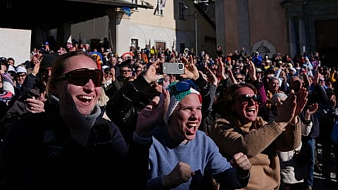 Fans react as they watch Federica Brignone wins a gold medal in an alpine ski at the 2026 Winter Olympics.