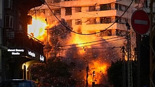 An explosion erupts from a building following an Israeli strike in central Beirut, Lebanon, 18 March 2026