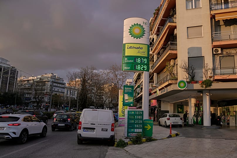 A sign showing current fuel prices stands outside a gas station in Athens, Greece, on Wednesday, March 11, 2026.