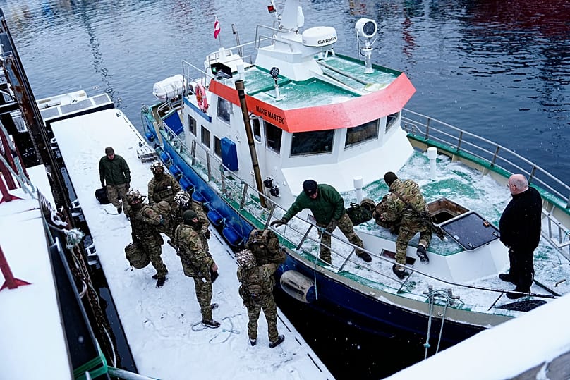 Danish soldiers disembark at the port in Nuuk, Greenland, on Sunday, Jan. 18, 2026.