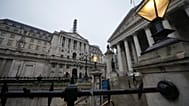 FILE -A man walks in front of the Bank of England, at the financial district in London. 5 Feb. 2026
