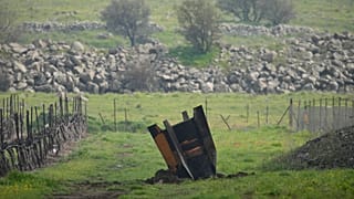 A fragment of a missile fired from Iran and intercepted by Israel in a field in the Israeli-occupied Golan Heights, Thursday, March 19, 2026.