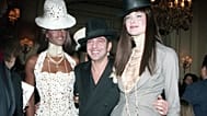 FILE: John Galliano, centre, with compatriot model Naomi Campbell, left, and another unidentified model after Christian Dior's 1997 spring-summer show in Paris