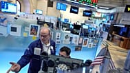 David O'Day, left, works on the floor at the New York Stock Exchange in New York. 18 March 2026. 