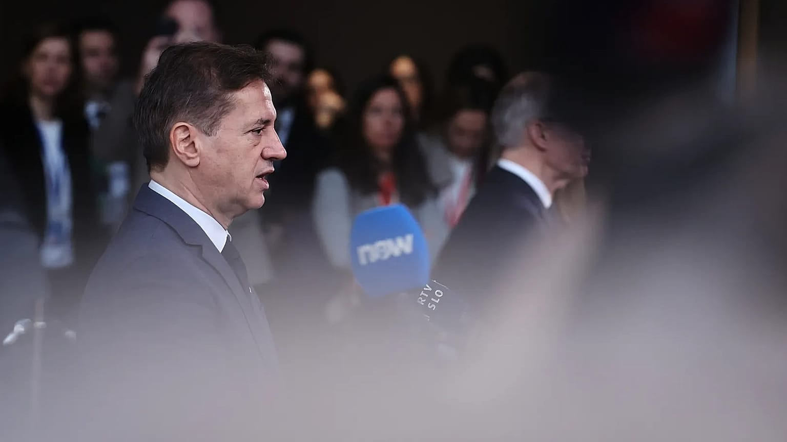 Slovenia's Prime Minister Robert Golob speaks with the media at the European Council building in Brussels, 19 March, 2026