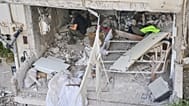 Israeli security forces examine an apartment building that was hit by an Iranian missile in Ramat Gan, Israel, Wednesday, March 18, 2026. (AP Photo/Oded Balilty)