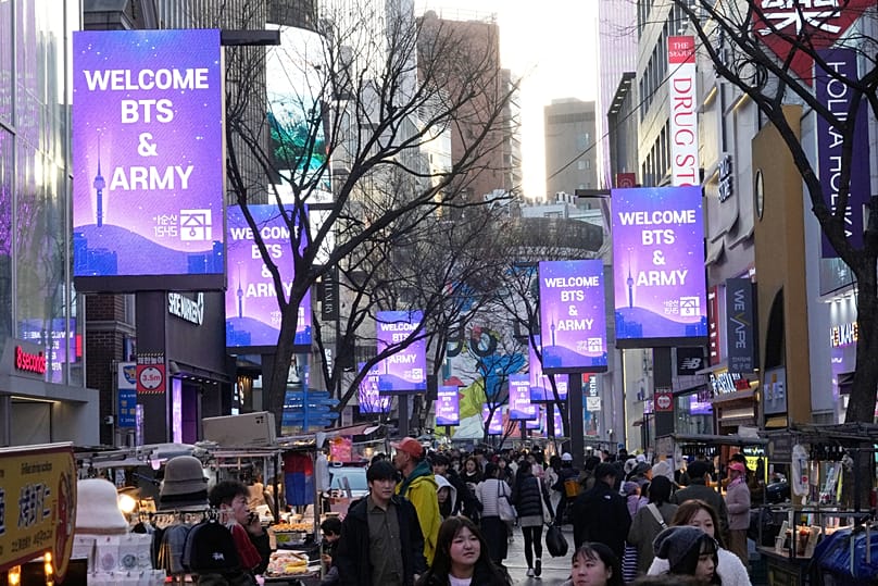 Messages welcoming BTS fans are displayed on screens ahead of a comeback concert of K-pop group BTS at a shopping street in Seoul, South Korea