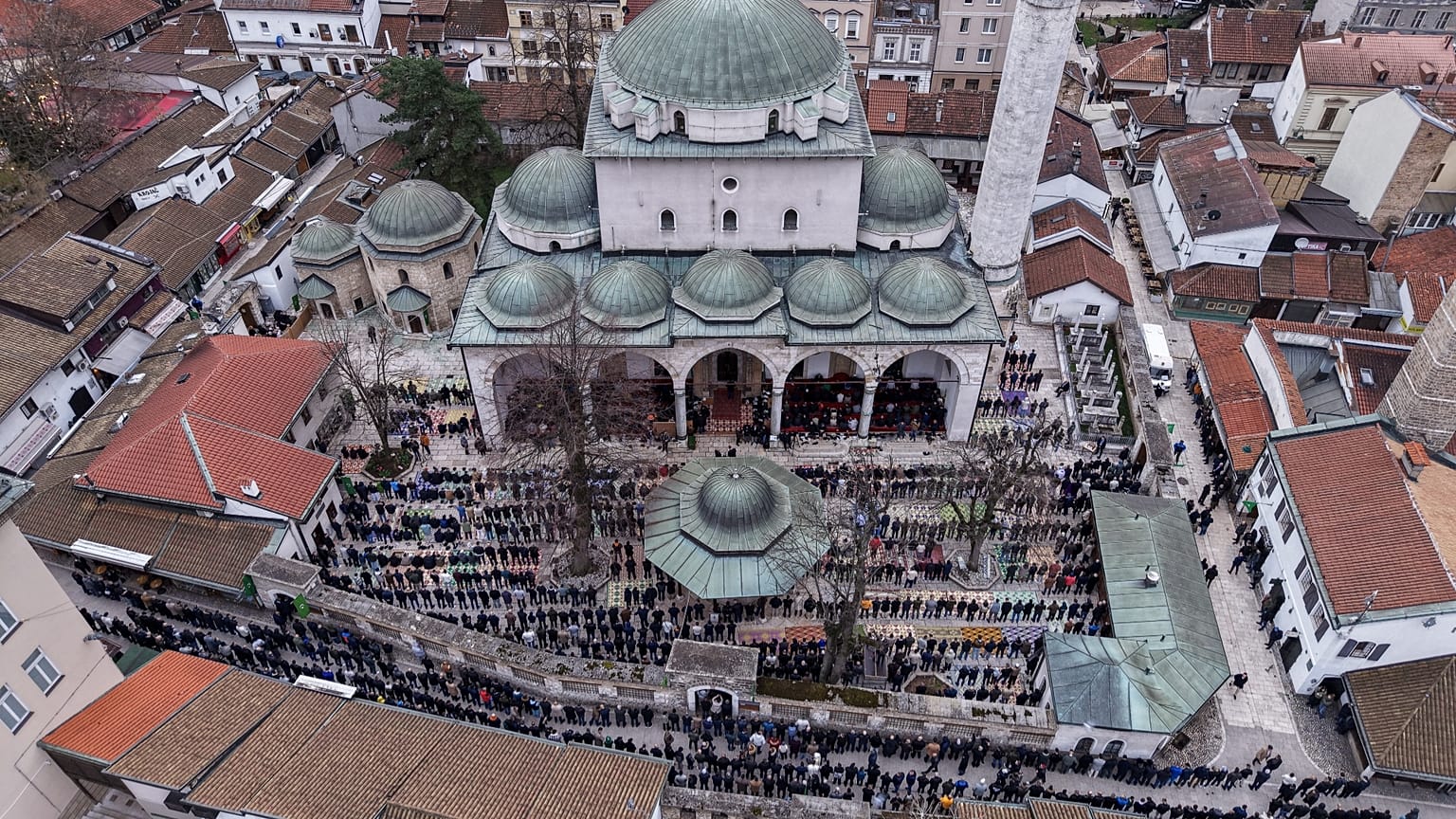Muslims celebrate Eid al-Fitr in front of the Gazi Husref Beg Mosque in Sarajevo.