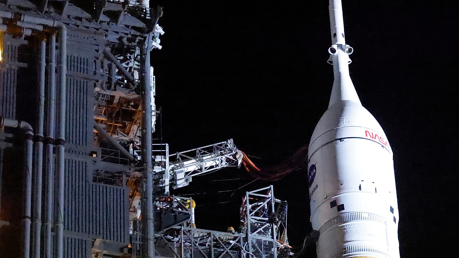 The Orion spacecraft sits on top of the NASA Artemis II rocket in the Vehicle Assembly Building before rollout to pad 39B at the Kennedy Space Center in Cape Canaveral.