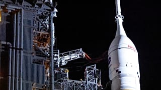 The Orion spacecraft sits on top of the NASA Artemis II rocket in the Vehicle Assembly Building before rollout to pad 39B at the Kennedy Space Center in Cape Canaveral.