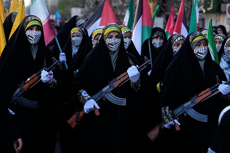Members of the Iranian Basij paramilitary force march in Tehran, 10 January, 2025