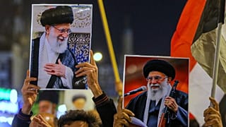 Iraqi Shiites hold pictures of Iranian Supreme Leader Ayatollah Ali Khamenei, who was killed by a U.S. airstrike in Tehran, during a symbolic funeral, in Najaf, Iraq, Sunday, 