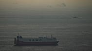 Cargo ships sail in the Arabian Gulf towards Strait of Hormuz in United Arab Emirates, Thursday, March 19, 2026.