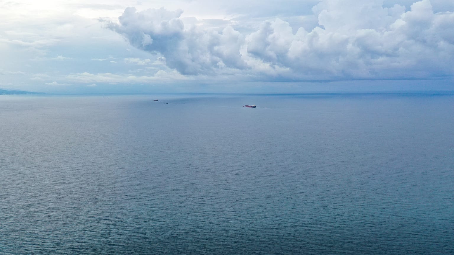 FILE: An aerial view shows the Minerva Symphony tanker, which sails under the Greek flag in the background at the Black Sea coast after an oil spill, near Novorossiysk, Russia