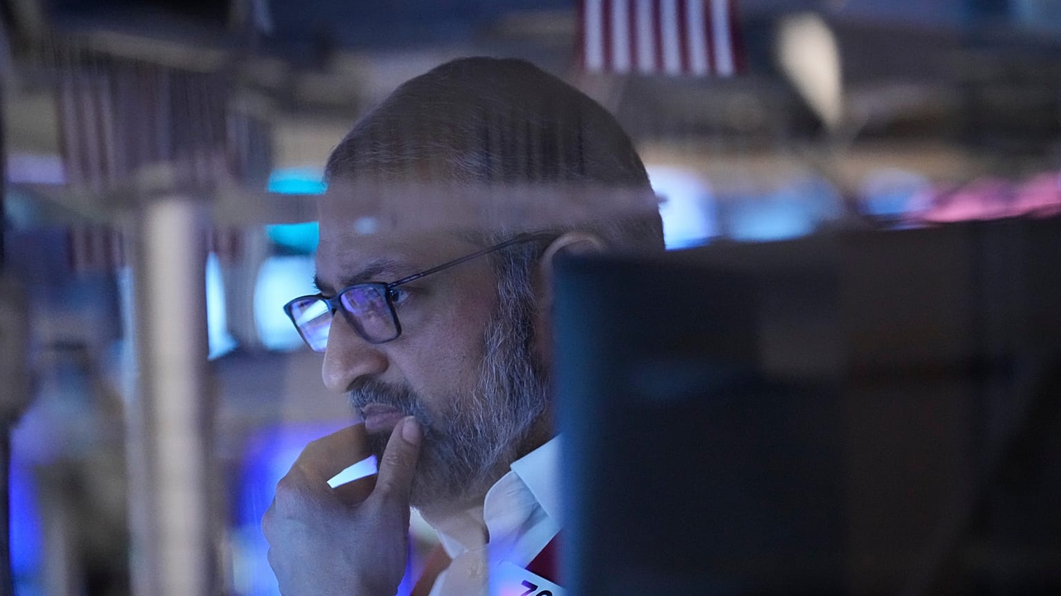 File - Aman Patel works on the floor at the New York Stock Exchange in New York, US. 19 March 2026