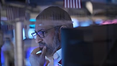 File - Aman Patel works on the floor at the New York Stock Exchange in New York, US. 19 March 2026