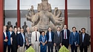 Group photo of Cambodia offcials and EFEO in front of the dancing Shiva
