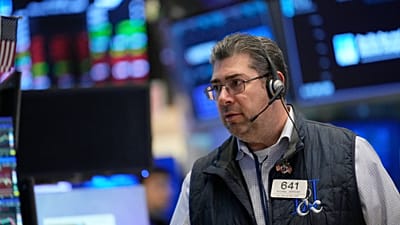 Michael Capolino works on the floor at the New York Stock Exchange, 19 March 2026