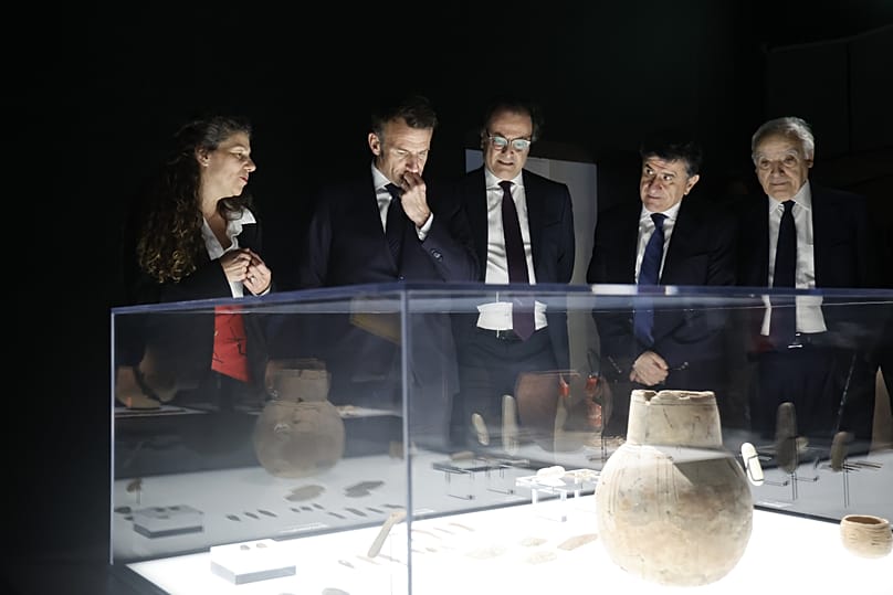 President Emmanuel Macron, center left, next to Ambassador of Lebanon to France Rabih Chaer, center right, and Director of Byblos archaeological site, Tania Zaven, left.