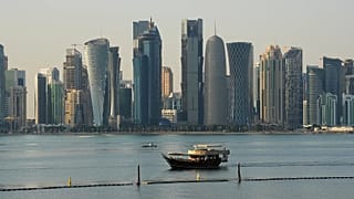 FILE: A boat makes its way past the Doha skyline in Doha, 18 January 2026