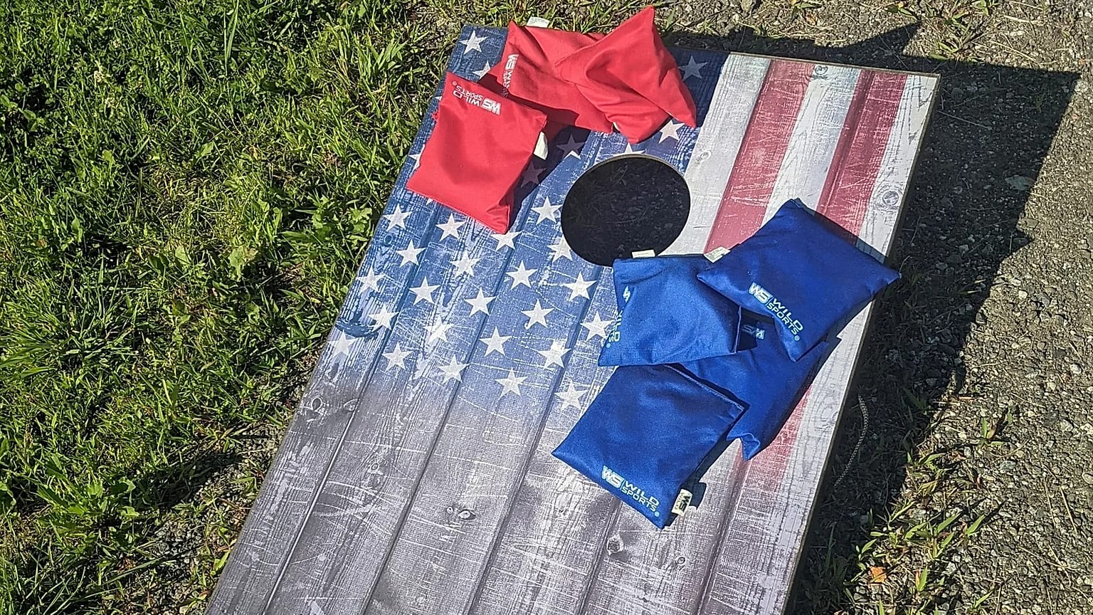 A United States flag cornhole board with bags in Marshfield, July, 2022