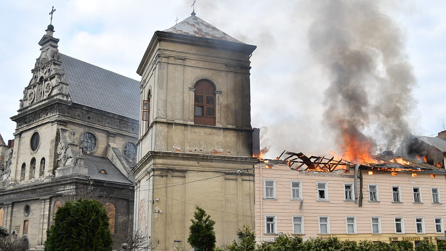 Fire and smoke rise above the city center following Russia's drone attack in Lviv, Ukraine, Tuesday, March 24, 2026. 