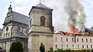 Fire and smoke rise above the city center following Russia's drone attack in Lviv, Ukraine, Tuesday, March 24, 2026. 