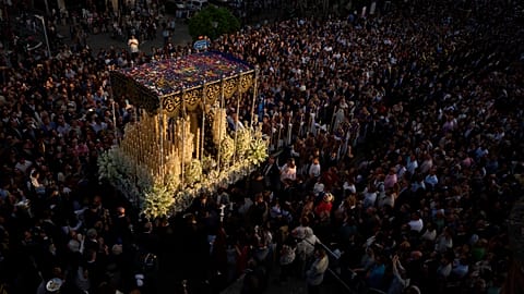 A statue of the Virgin Mary is carried in procession through the streets of Seville during Holy Week, Spain, on Sunday 13 April 2025.