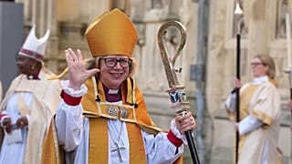 Sarah Mullally waves as she leaves after the Enthronement Ceremony installing her as archbishop of Canterbury in Canterbury, 25 March, 2026