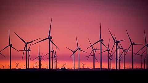 Wind turbines stand in a wind farm in the Soenke-Nissen-Koog at the North Sea in Bordelum in the sunrise Tuesday, March 9, 2021. 