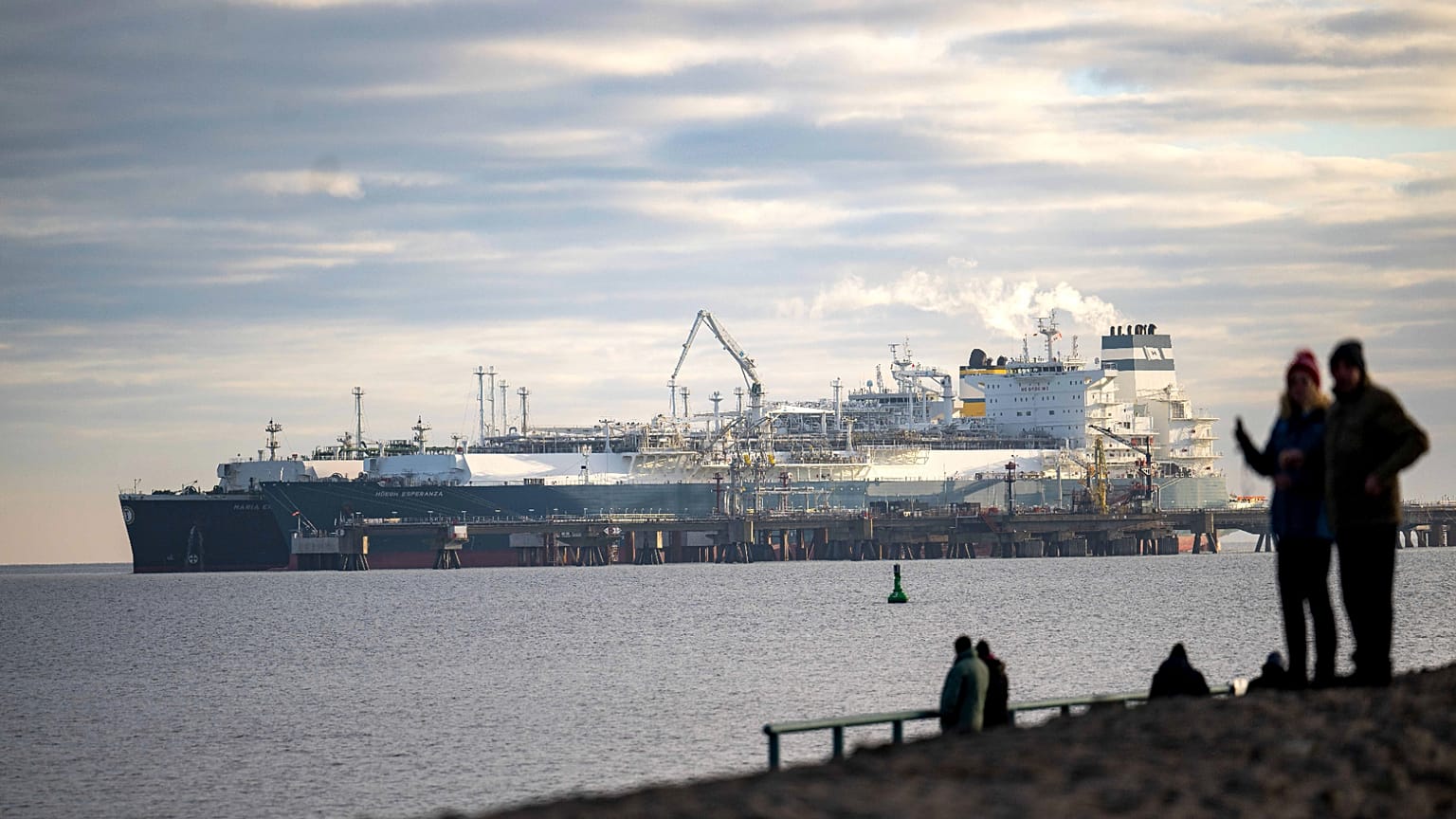 The tanker Maria Energy, left, loaded with liquefied natural gas, is moored at the floating terminal Hoegh Esperanza, in Wilhelmshaven, Germany, Jan. 3, 2023.