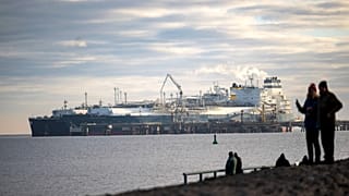 The tanker Maria Energy, left, loaded with liquefied natural gas, is moored at the floating terminal Hoegh Esperanza, in Wilhelmshaven, Germany, Jan. 3, 2023.