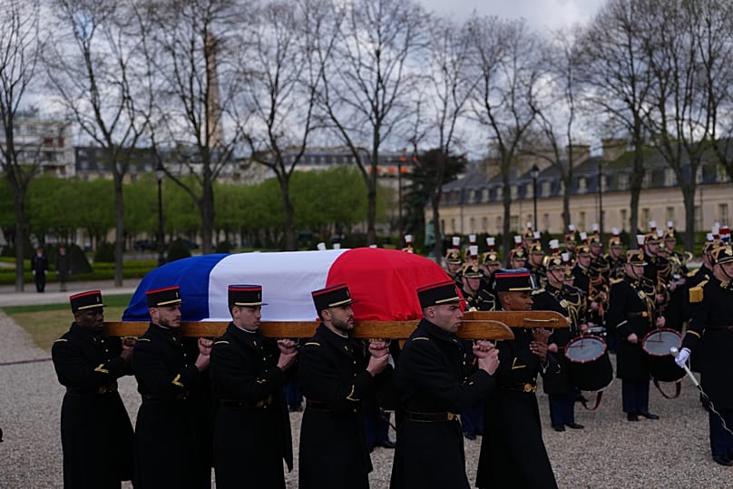 French Republican Guards carry the coffin of late French Prime Minister Lionel Jospin during a national homage ceremony in Paris, 26 March, 2026