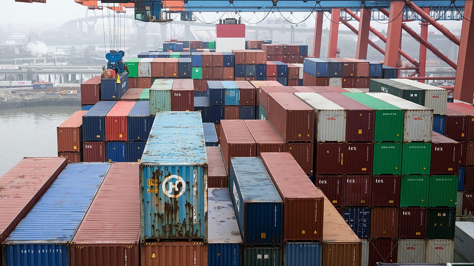 Containers are unloaded by a freighter at the Eurokai terminal (Eurogate) in the port of Hamburg, Germany, March 22, 2019